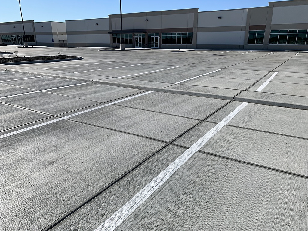 Large commercial concrete parking lot with saw-cut control joints in Conroe, TX